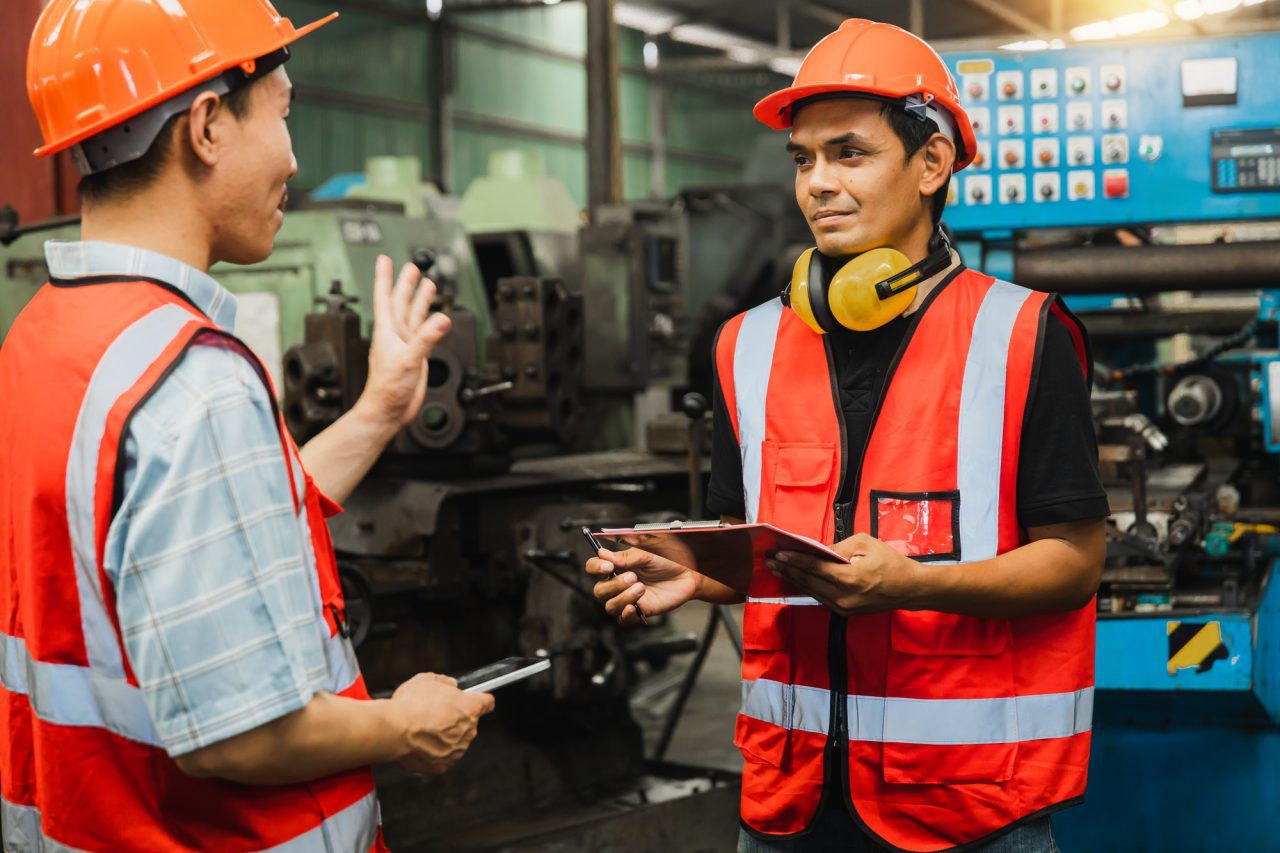 electric engineer talking and working with partner in industry.jpg