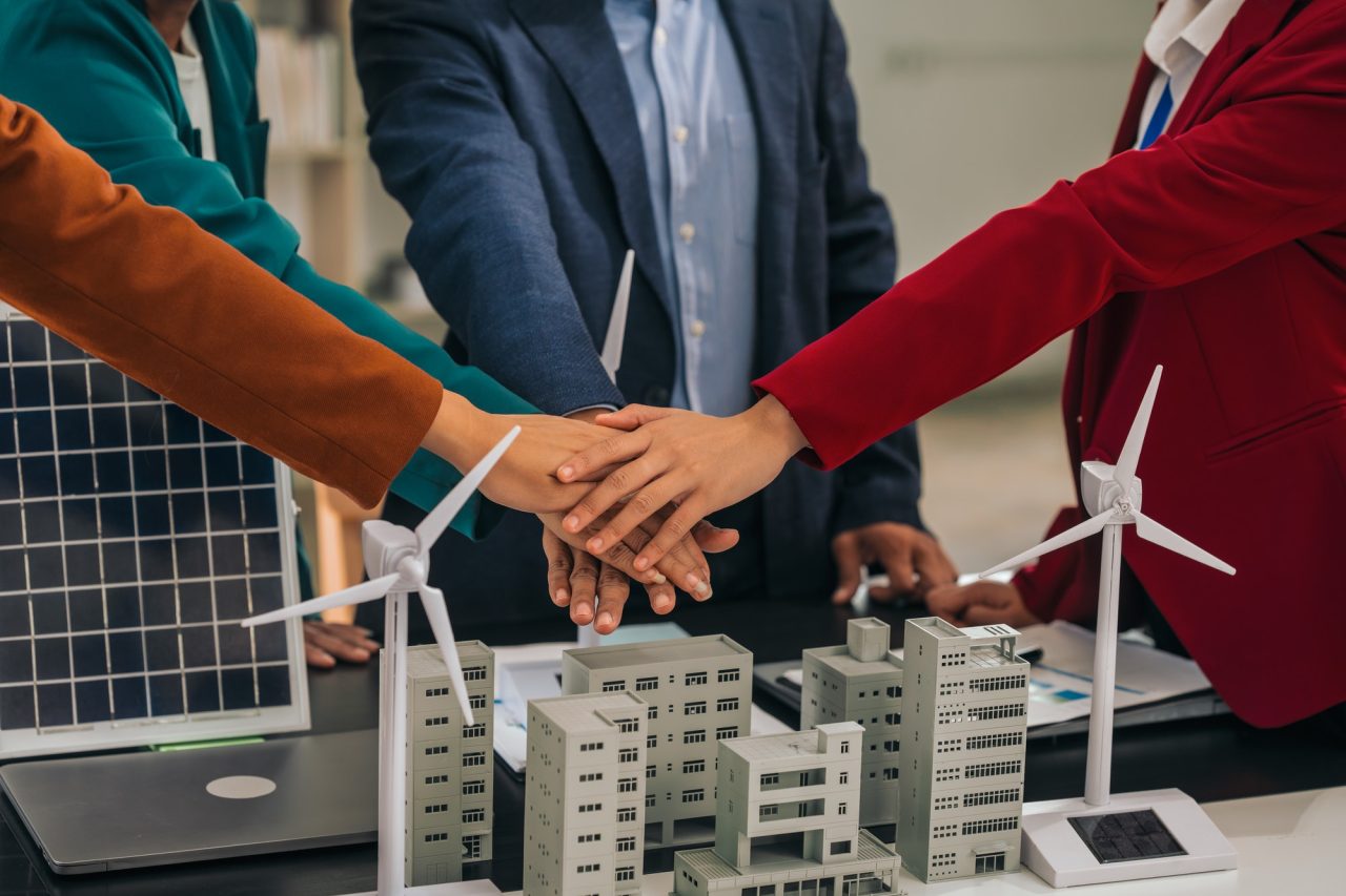 group asian business people meeting boardroom clean energy city solutions discussing solar panels.jpg