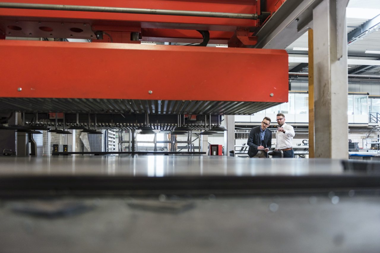 two men with tablet discussing on factory shop floor.jpg